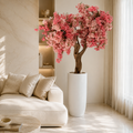 Cerisier rose dans un cache-pot blanc mat pour décoration intérieure | Solérive